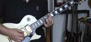 Play "One" by U2 on electric guitar