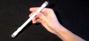 Do the Extended Thumbaround pen spinning trick