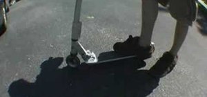 Do a fakie slider on a kick scooter