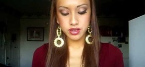 Create a bronze and gold eye shadow look