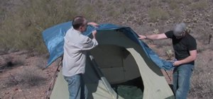 Set up a tent when camping outdoors