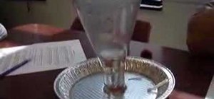 Get liquid to rise into a glass with a candle
