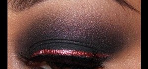 Create a matte black smoky eye with red liner and red lips