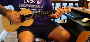 Play "Here Comes the Sun" by the Beatles on baritone ukulele