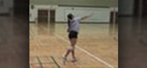 Serve overhand in a game of volleyball