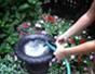 Turn a salvaged urn into a garden fountain