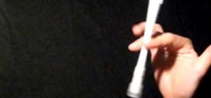 Do the Fingerpass Normal pen spinning trick