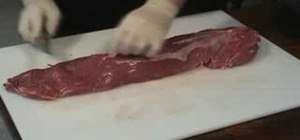 Trim and prepare a beef tenderloin for cooking