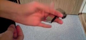 Do a hand flip trick with a Zippo lighter