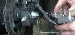 Replace the front brake pads on a 2009 Kawasaki Ninja 250 motorcycle