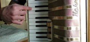 Play "Lara's Theme" from Dr. Zhivago on the accordion