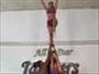 Do an extension stunt in cheerleading