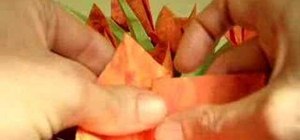 Fold an orange origami flower