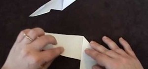 Fold a ninja star out of paper using origami