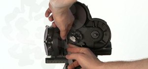 Load the Arriflex S 16mm camera properly