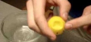 Remove a dent from a ping pong ball