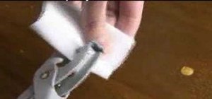 Use eyelet pliers to attach grommets
