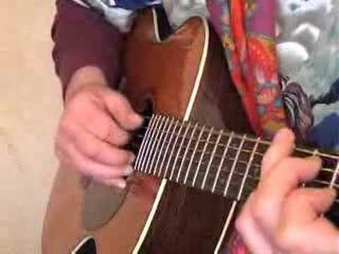 Play chords on the guitar in a Delta blues style
