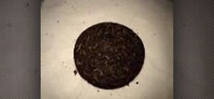 Break up a Chinese Puerh tea cake with a letter opener