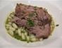 Roast seven-hour lamb with minted cannelloni beans