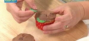 Decorate green glittered pinecone cupcakes for Christmas