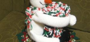 my huggy snowman i made last dec 2009 & the doily