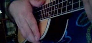 Play a muted strum on the ukulele