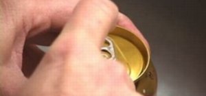 Stop soda from fizzing by tapping it with your finger