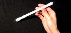 Do the Thumbaround Normal pen spinning trick