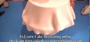 Cover a styrofoam dummy cake with fondant