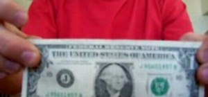Perform a torn and restored dollar bill trick