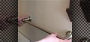Install a towel bar on a bathroom wall or hollow door