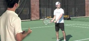 Start with racket back in a one-handed backhand