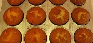 Bake orange and white "Happy Halloween" vanilla cupcakes