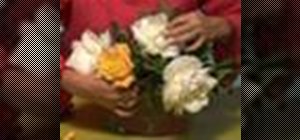 Arrange flowers in a wide shallow vase