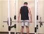 Do reverse barbell shrugs to exercise the back