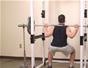 Do barbell squats with chains