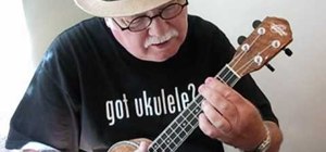 Play the "Silent Night" Christmas carol on the ukulele