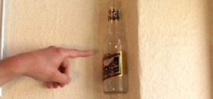 Stick a beer bottle  to a wall without glue or gum