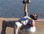 Do a one arm dumbbell chest press exercise