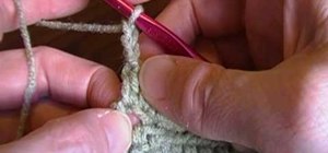 Make a double crochet stitch