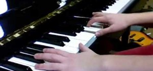 Play "Something About Us" by Daft Punk on piano