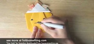Fold an origami pumpkin and design a Jack-O-Lantern