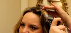 Curl your hair with a curling iron and add volume