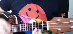 Play "Hallelujah" by Leonard Cohen on the ukulele