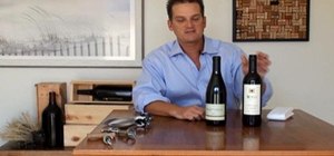 Open a bottle of wine with a traditional corkscrew