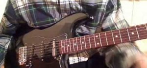 Play "Bad" by U2 on the electric guitar (with and without delay)