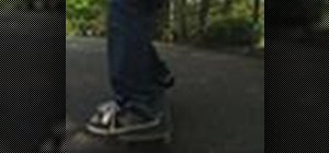 Perform a frontside boardslide on a street skateboard