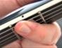 Avoid fret buzz on an electric guitar with techniques