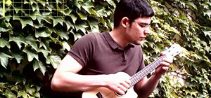 Play "Blackbird" by the Beatles on the ukulele